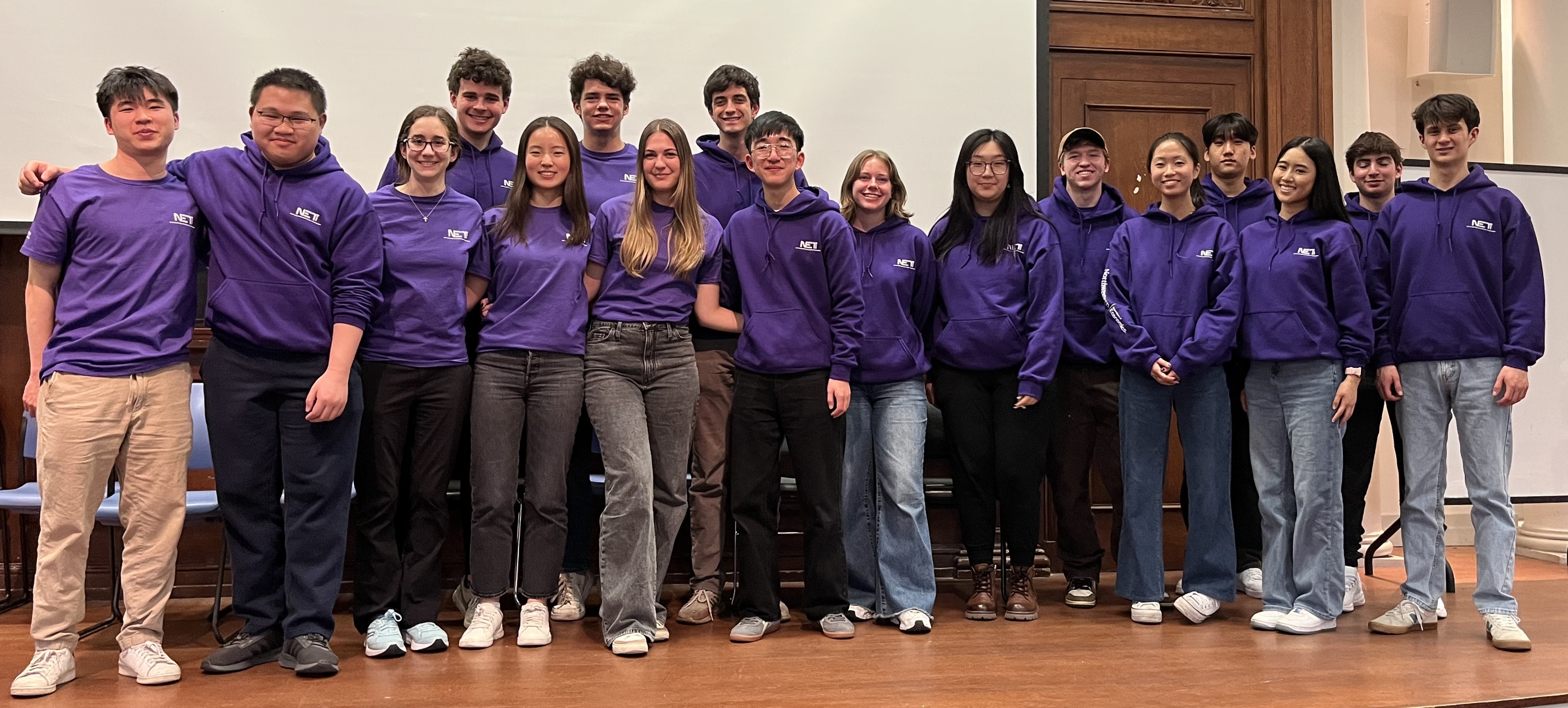 A group of students standing and smiling