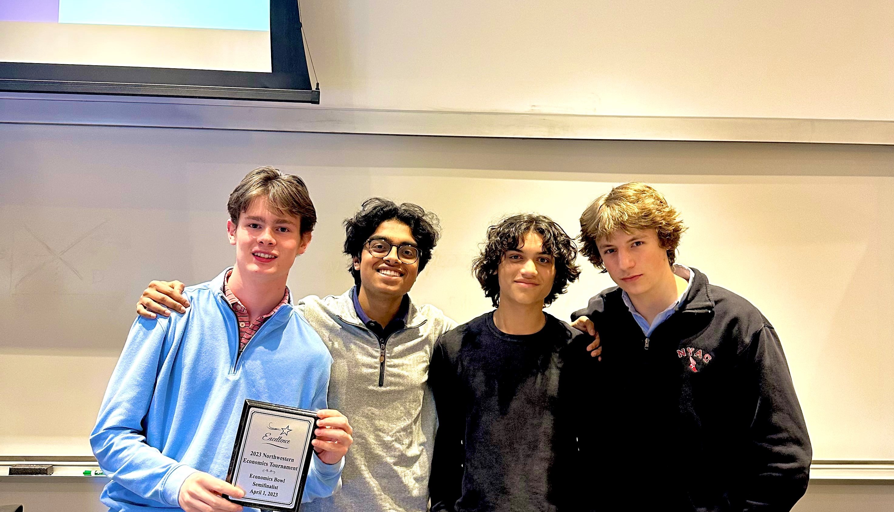 Phillips Exeter Academy team holding their semifinalist plaque.